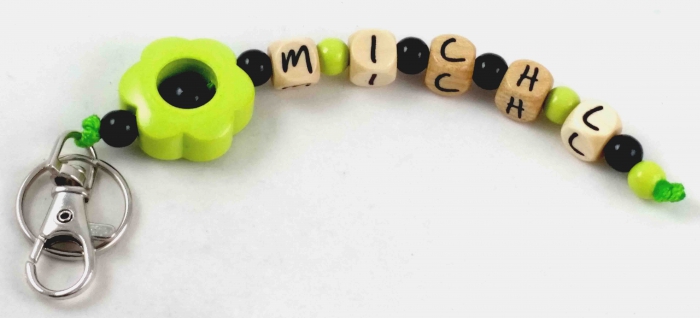 Schlüsselanhänger mit Name "Blume" in lemon/schwarz