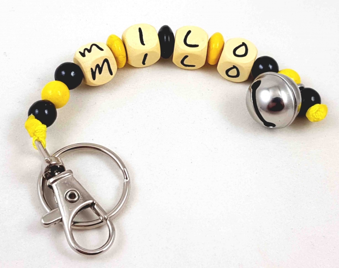 Schlüsselanhänger mit Name "Glöckchen" in gelb/schwarz